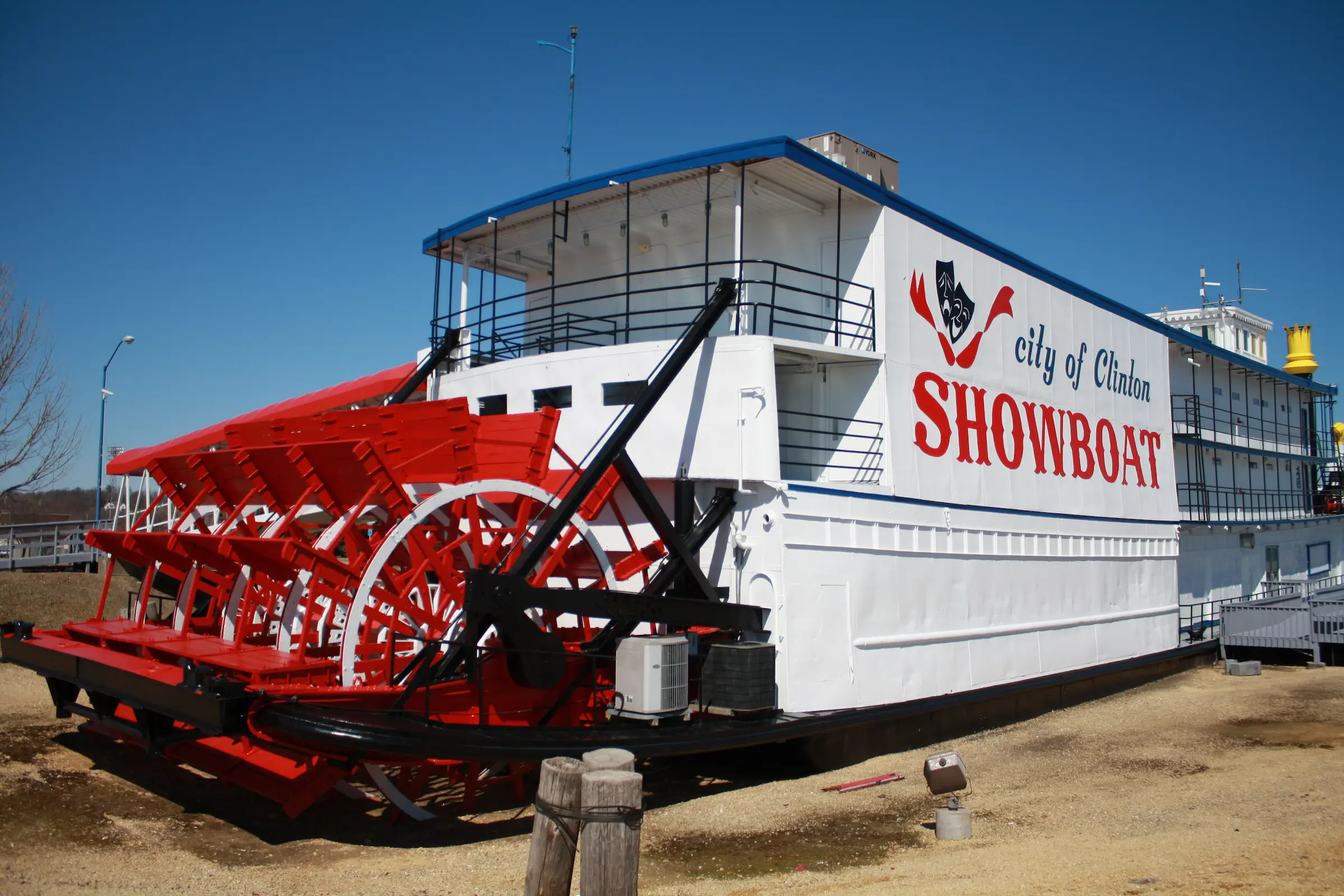 The City of Clinton Showboat, a red and white paddlewheel riverboat on the Mississippi River in Clinton, Iowa